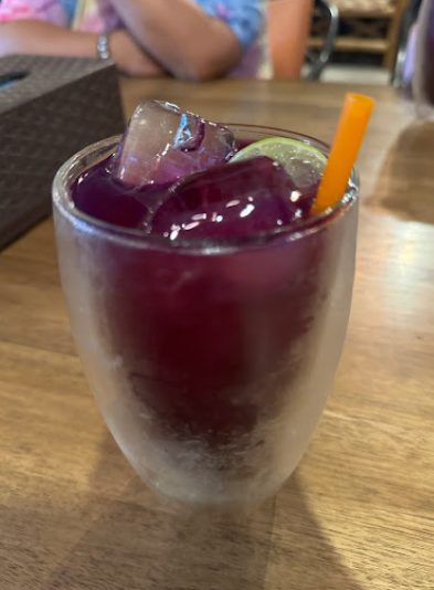 Purple iced drink at a table