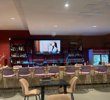 Bar seating facing a television